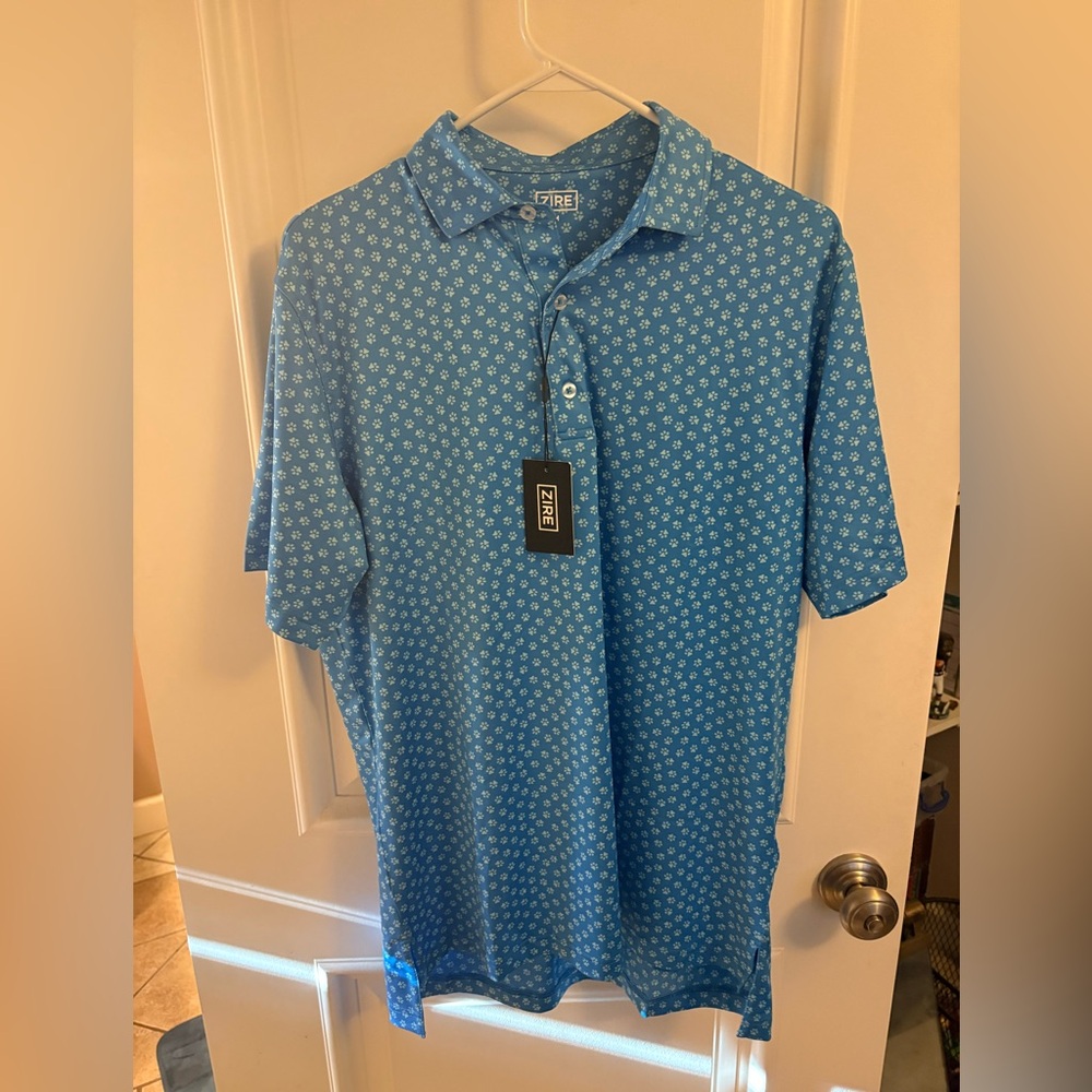 Light blue polo with dog paw prints NWT